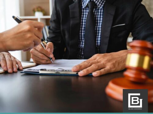 Two professionals discuss legal documents at a desk with a gavel nearby, illustrating how IRS Collection Expiration (CSED) affects bankruptcy cases.