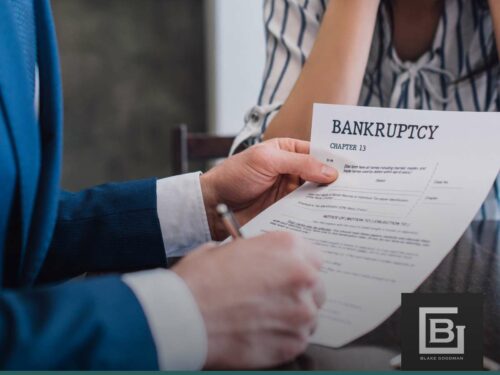 Man reviewing Student Loans In Chapter 13 bankruptcy paperwork with attorney.